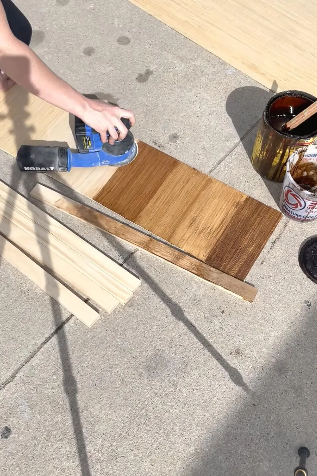 Testing stains before applying to a board and batten bathroom wall. 